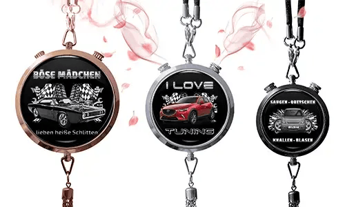 Three round pendants with car themes on black backgrounds. Left: vintage car with German text and checkered flags. Center: red SUV, 