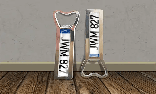 two bottle opener magnets on the floor