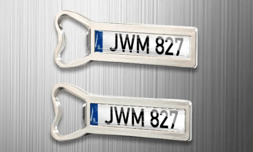 two magnet bottle openers on the fridge