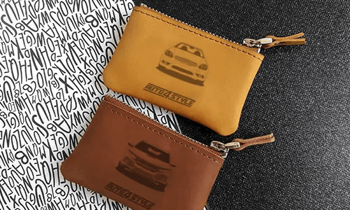 Brown leather pouch with zipper, printed car front and plate 