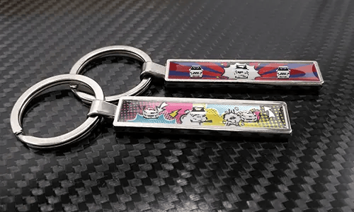 Metal comic car keychains with colorful pop art vehicle designs